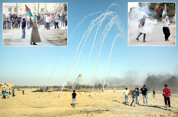 فلسطین: اسرائیلی فوج غزہ میں مظاہرین پر آنسوگیس کی بارش کررہی ہے‘ مغربی کنارے میں نوجوان شیل واپس صہیونی اہلکاروں کی جانب پھینک رہا ہے