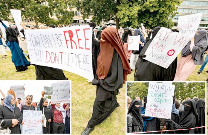 ہالینڈ: برقع پر پابندی کے خلاف نقاب پوش خواتین احتجاج کررہی ہیں‘ دیگر عورتیں بھی اظہارِ یکجہتی کے لیے موجود ہیں