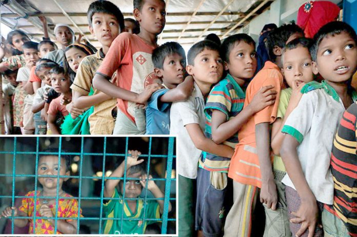 بنگلادیش میں قائم پناہ گزین کیمپوں میں رہنے والے روہنگیا مسلمانوں کے بچے خوراک کے حصول کے لیے قطار میں کھڑے ہیں