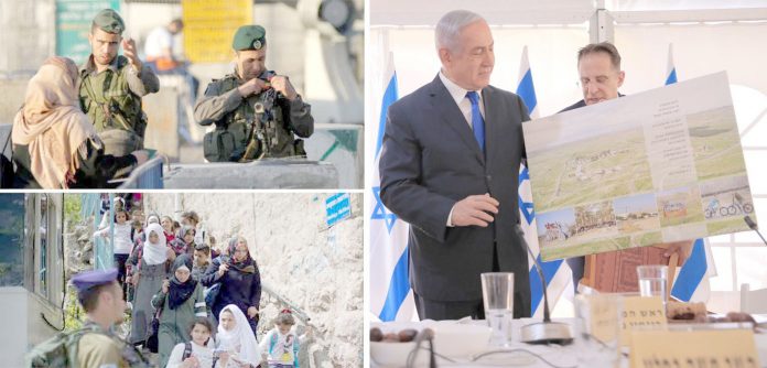 مقبوضہ بیت المقدس: اسرائیلی وزیراعظم بنیامین نیتن یاہو مغربی کنارے میں نئی یہودی بستی کا نقشہ دکھا رہے ہیں‘ قابض فوج نے ناکابندی کررکھی ہے